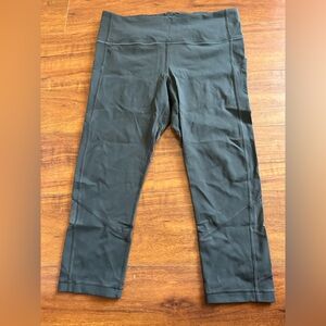 Women’s Lululemon Leggings in Dark Grey. Mesh Panels in back of ankles, 23’.